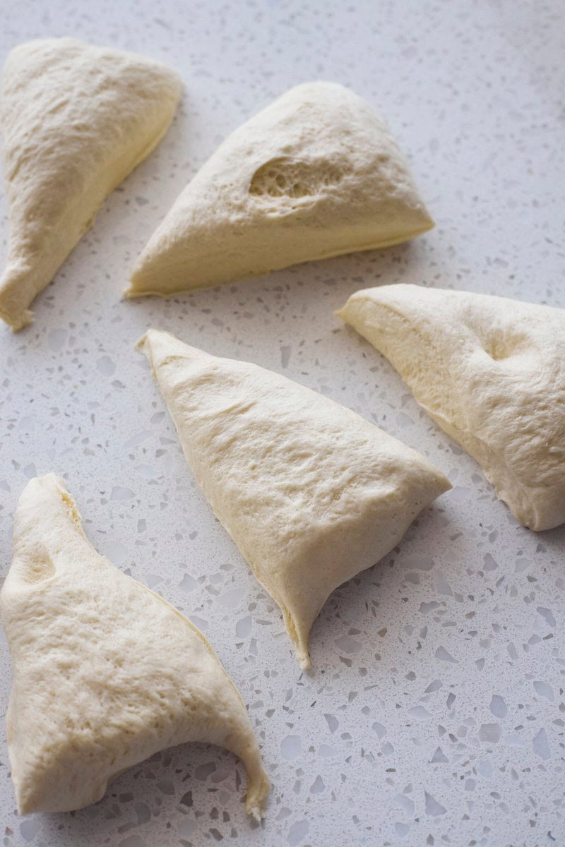 Dough divided into equal-size pieces.