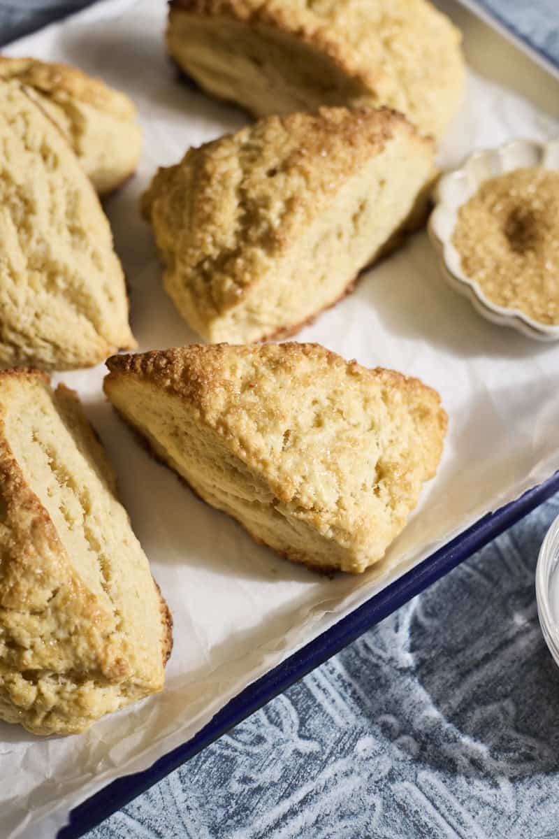Baked scones on a white tray.