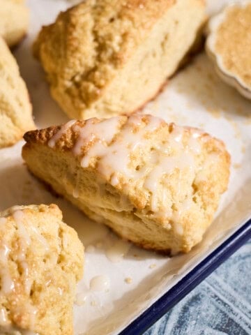 Sourdough Discard Scones drizzled with glaze.