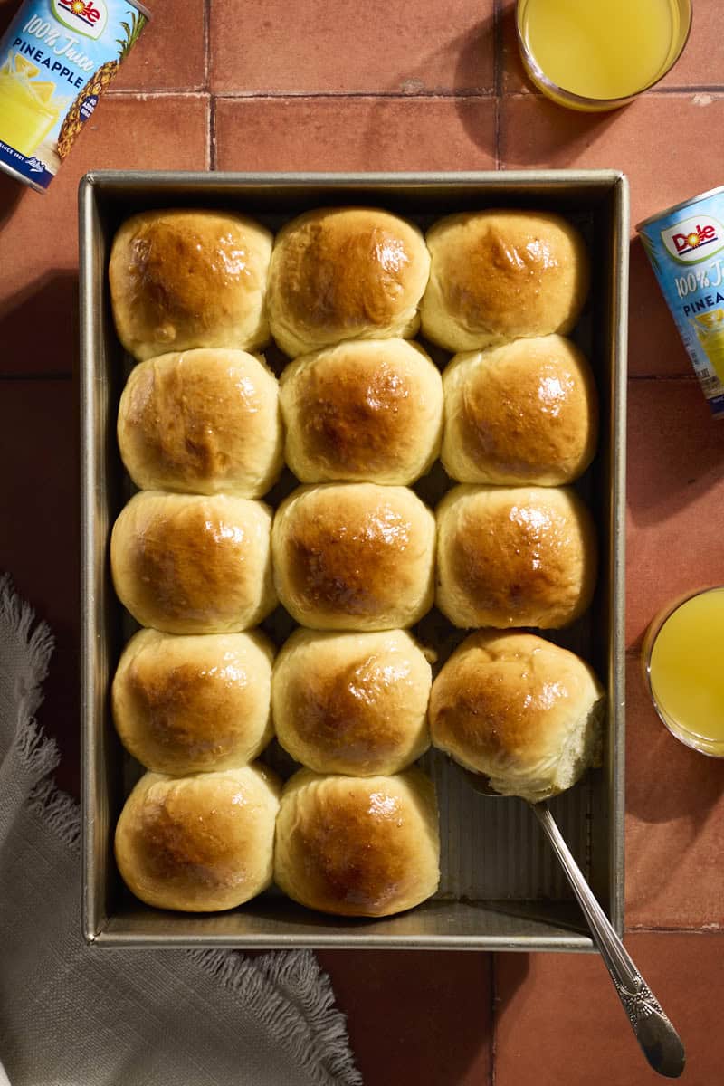 An overhead view of a pan full of Hawaiian Dinner Rolls.
