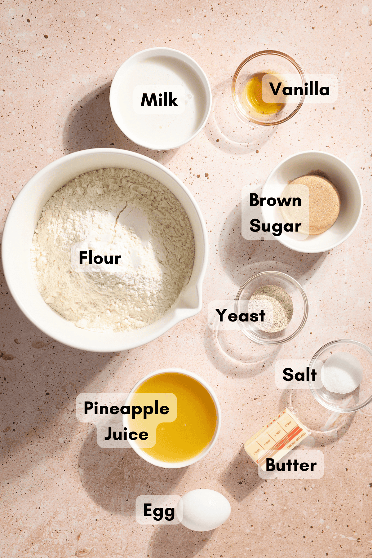 Ingredients for Hawaiian Dinner Rolls in small bowls. 