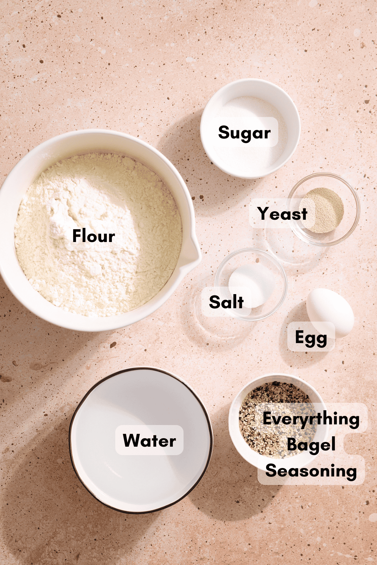 Ingredients for Homemade Everything Bagels in small bowls. 