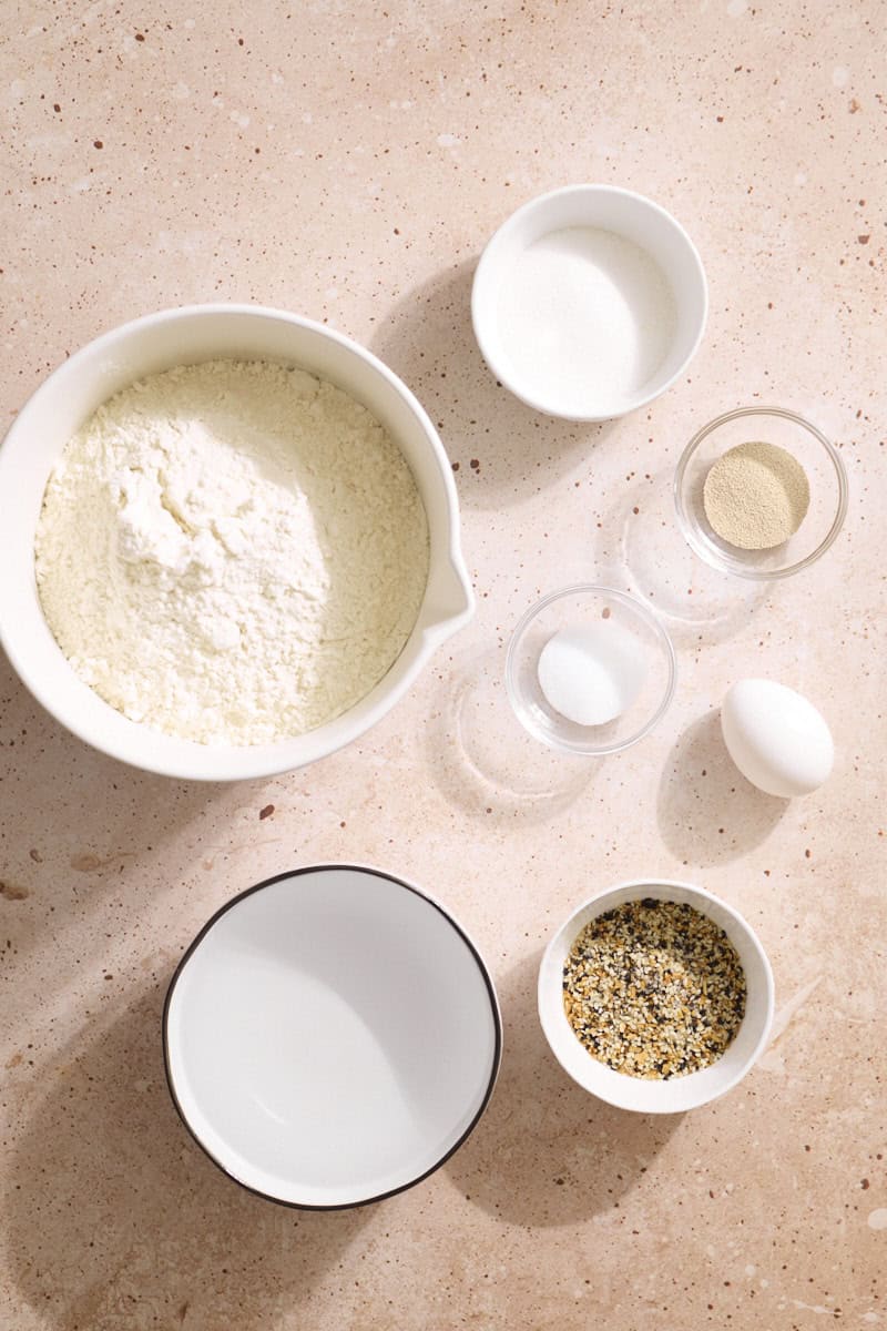 Ingredients for Homemade Everything Bagels in small bowls.