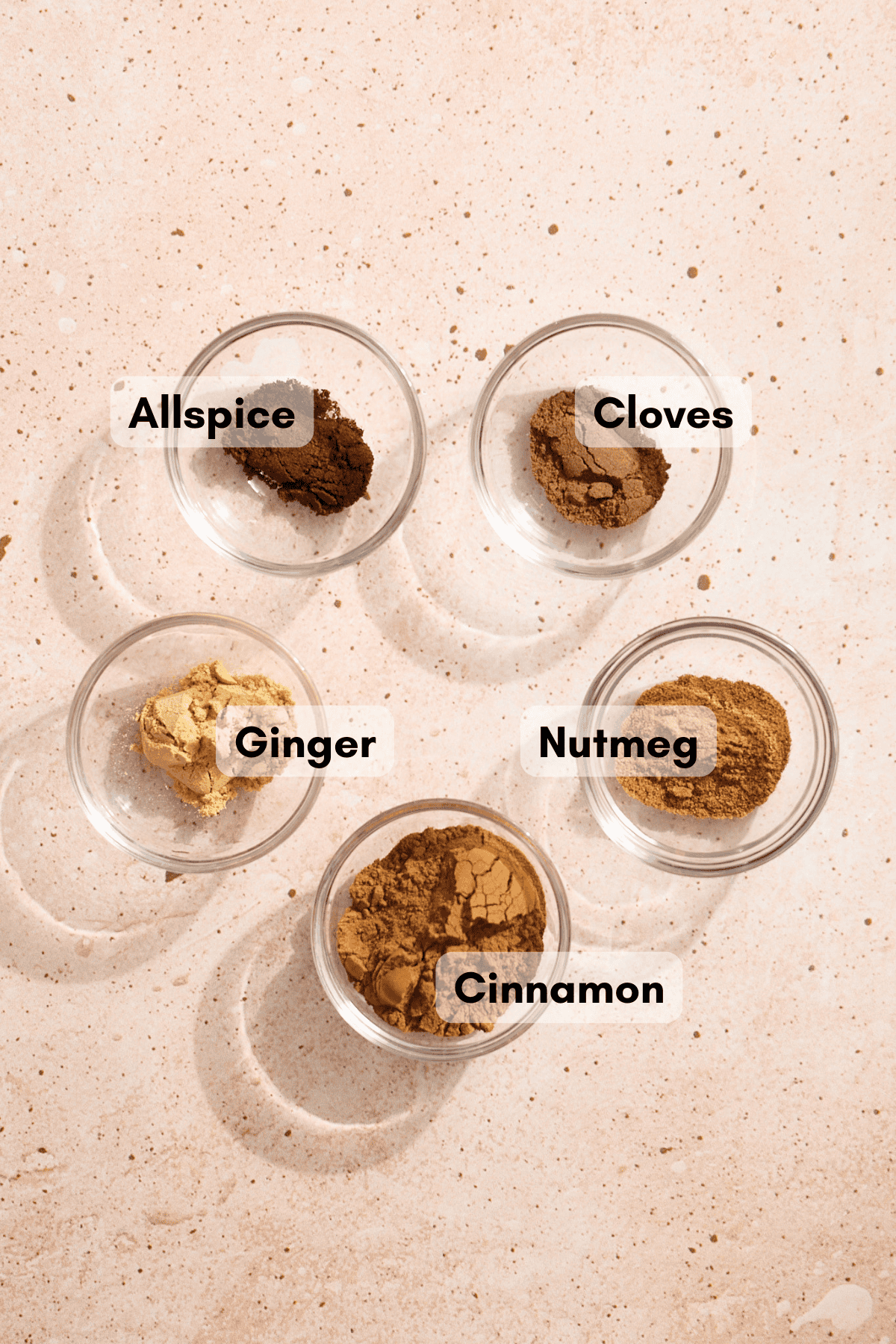 Ingredients for Pumpkin Pie Spice in small bowls. 