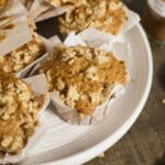 Sourdough Discard Pumpkin Muffins in a pile on a white platter.
