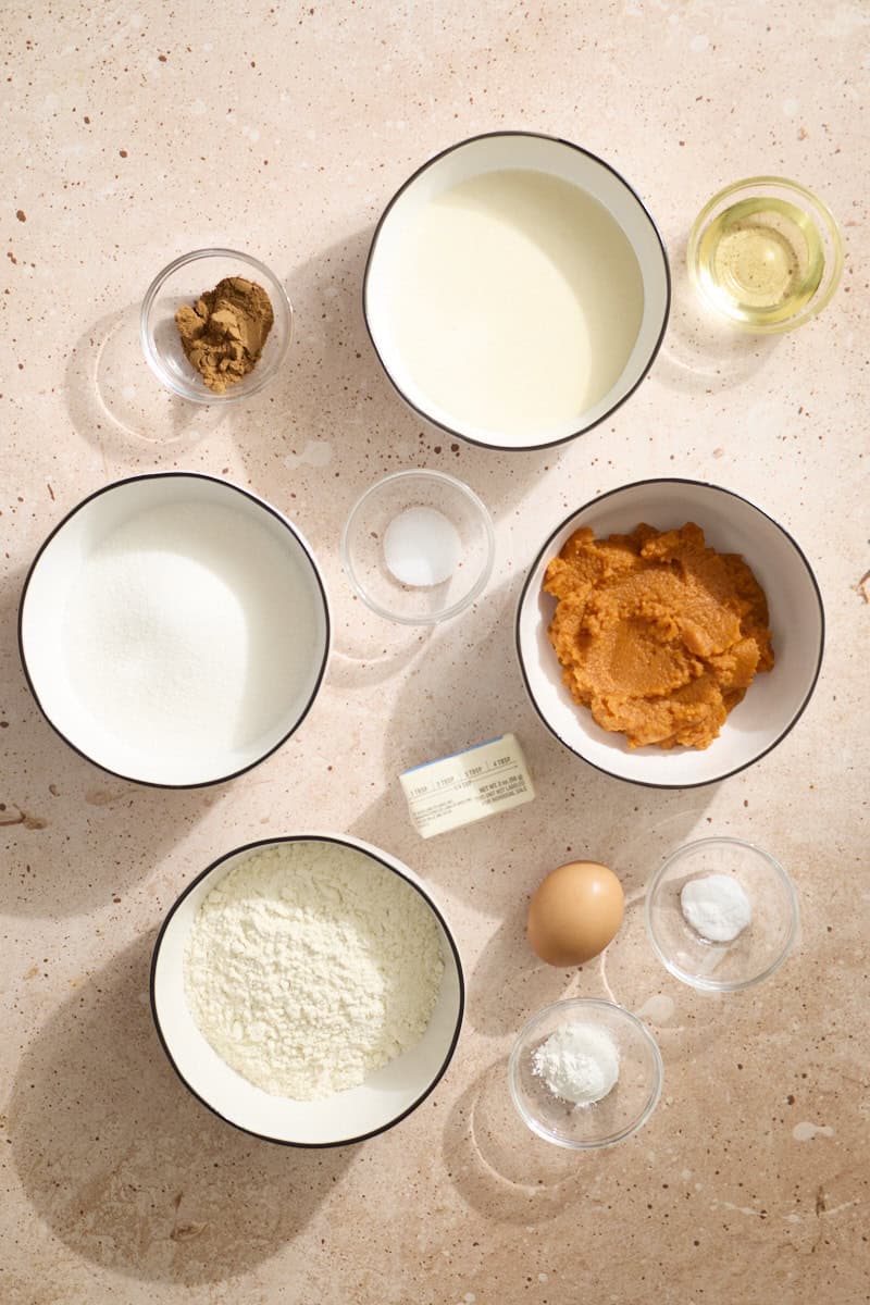 Ingredients for Sourdough Discard Pumpkin Muffins in small bowls.