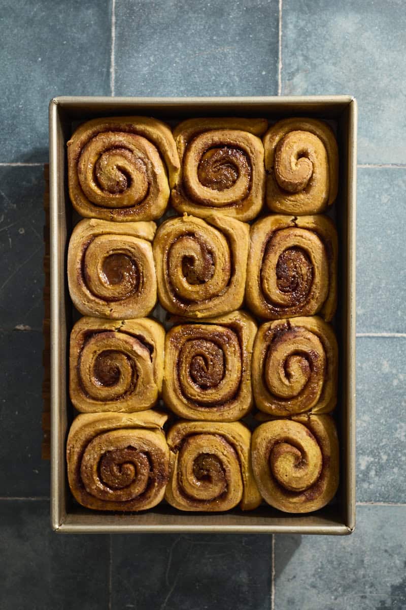 Baked rolls in a baking pan.