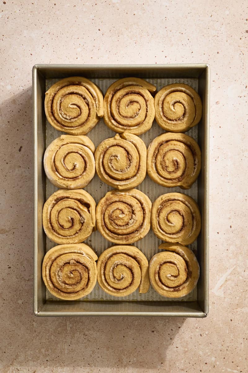 Sourdough Discard Pumpkin Cinnamon Rolls ready to bake in the pan.