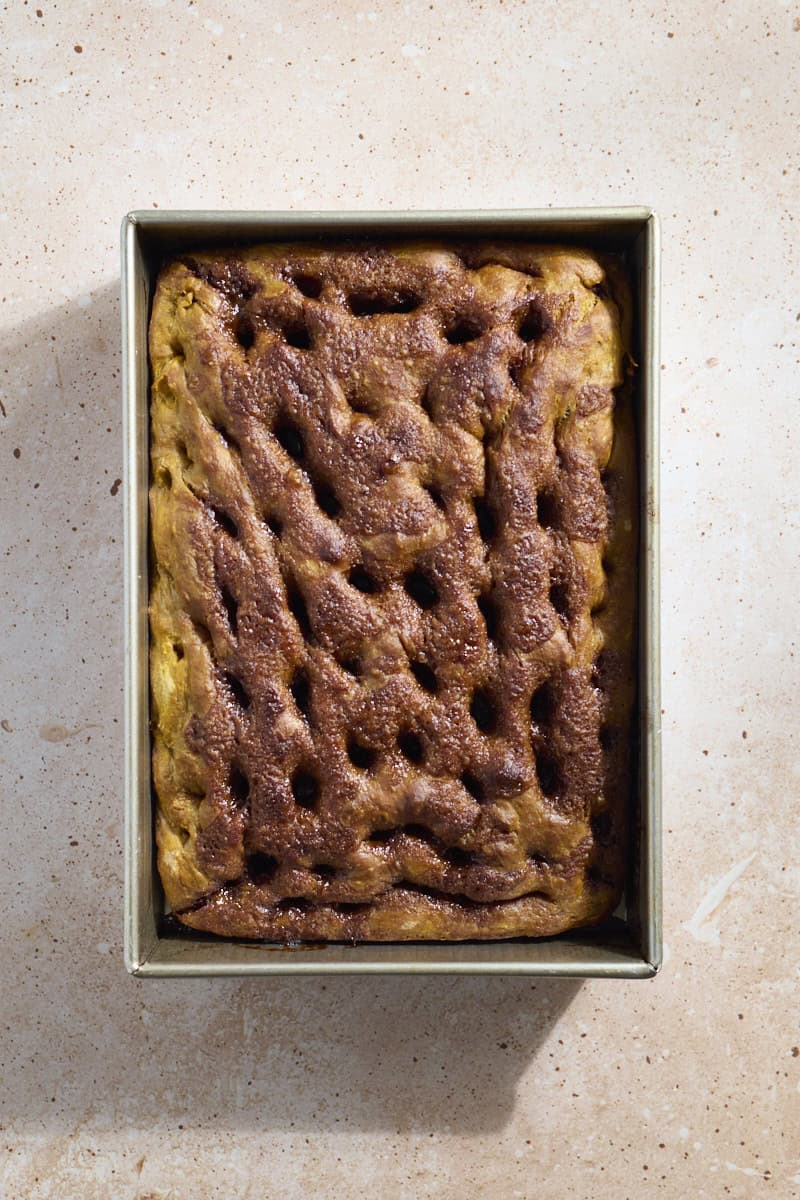 Pumpkin Cinnamon Roll Focaccia in the pan after baking.