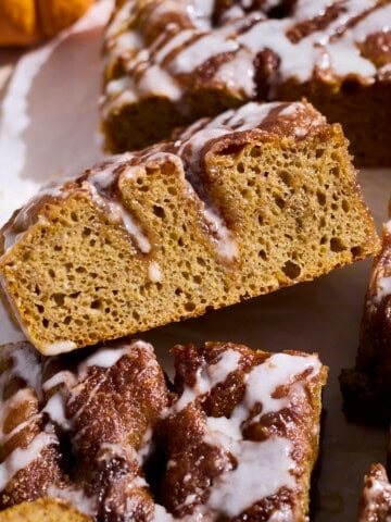 A side view of a piece of Pumpkin Cinnamon Roll Focaccia.