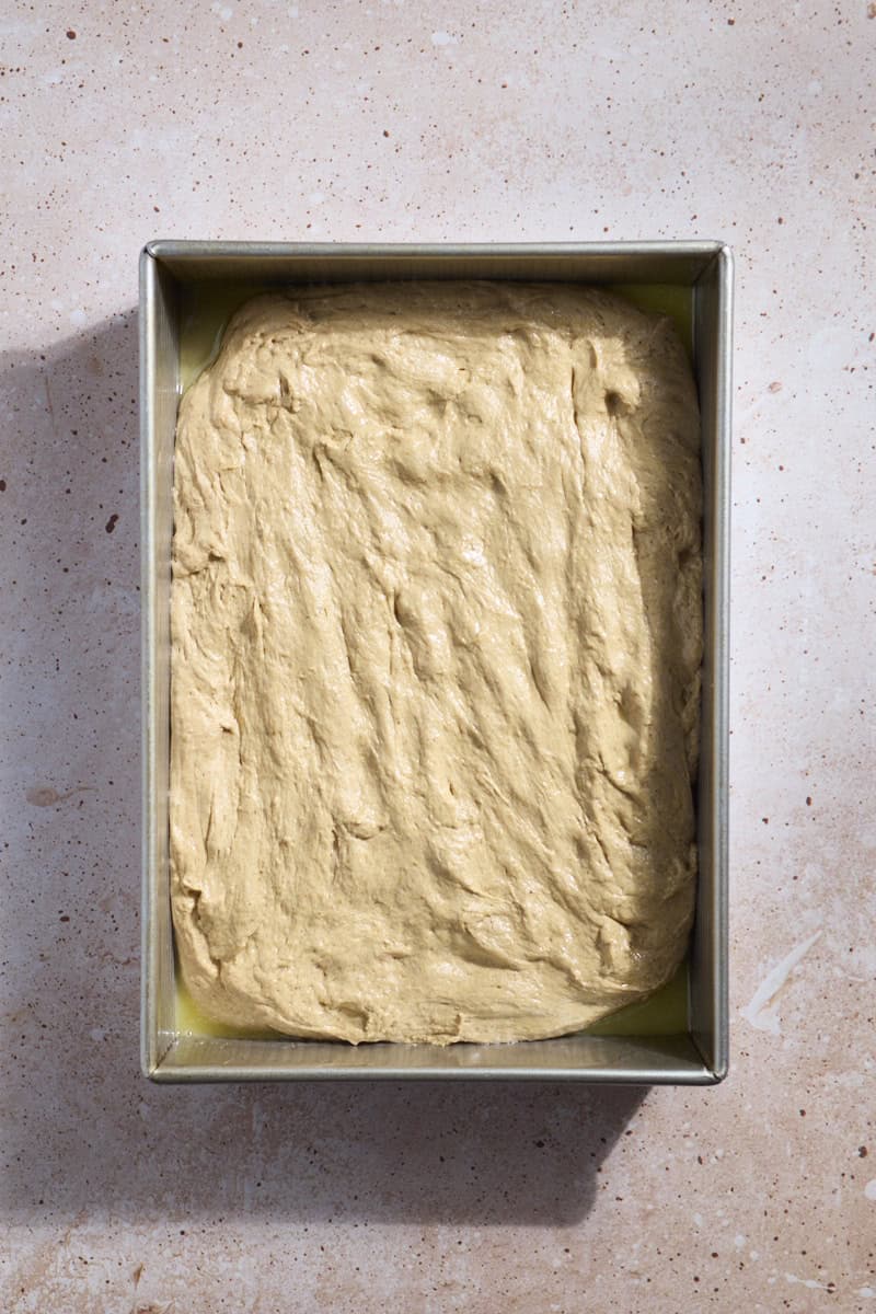 Dough spread in a baking pan.