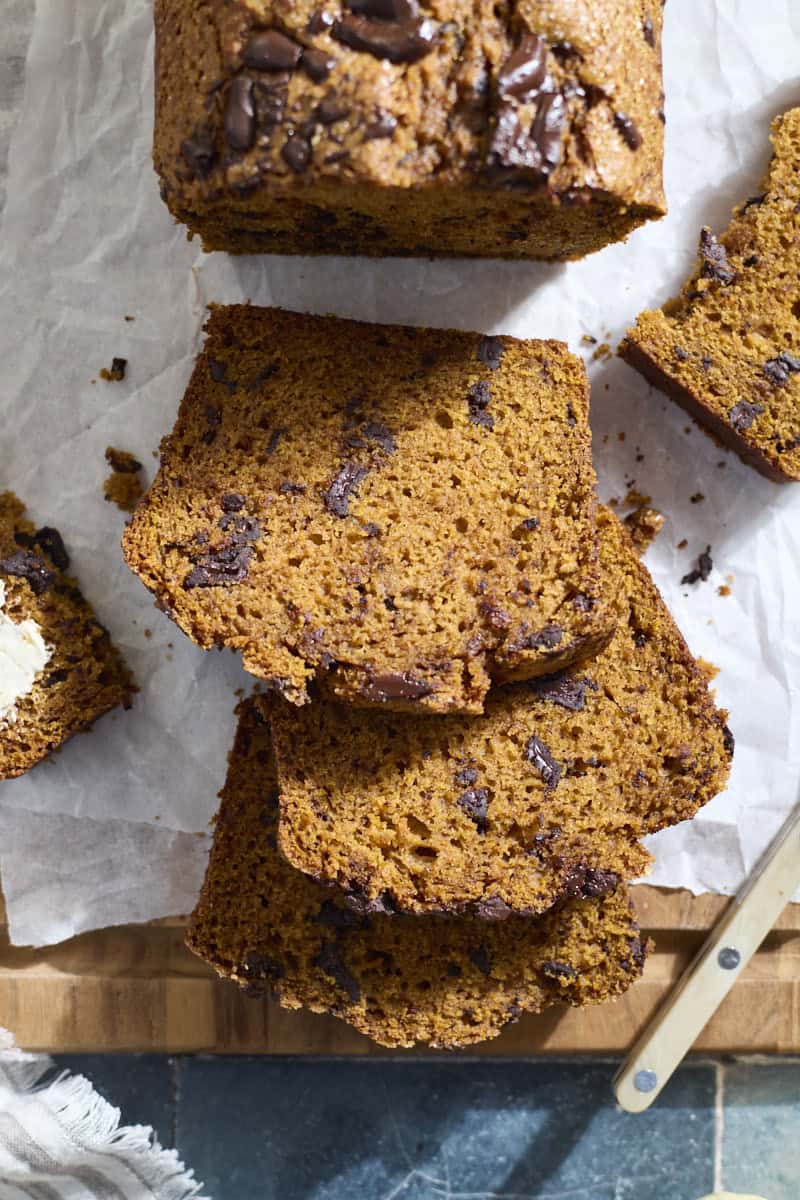 An overhead view of slices of Sourdough Discard Pumpkin Chocolate Chunk Bread.