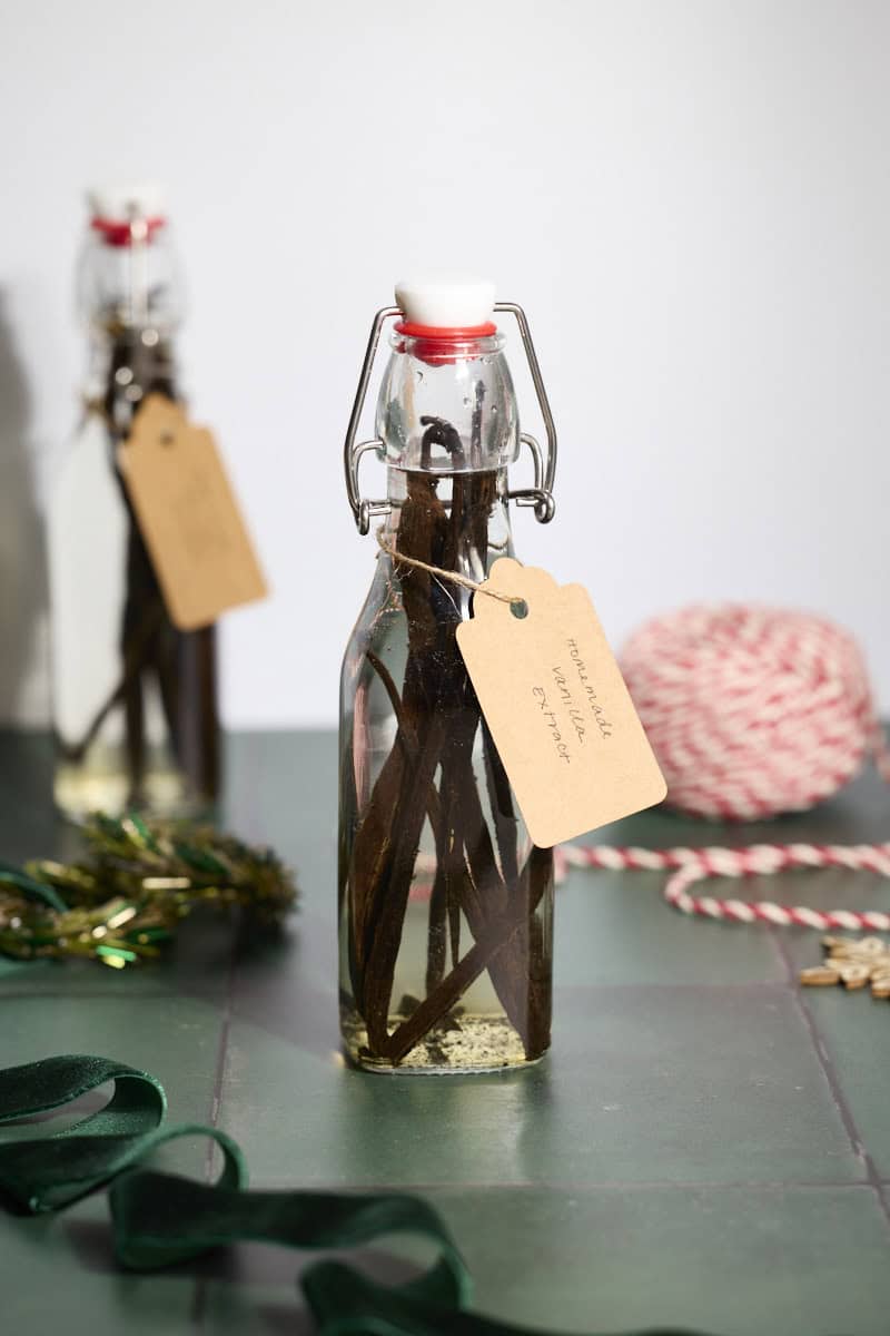 Two bottles of Homemade Vanilla Extract with brown tags.