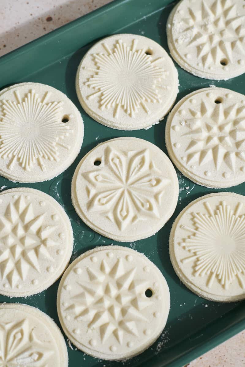 Ornaments drying on a baking sheet.