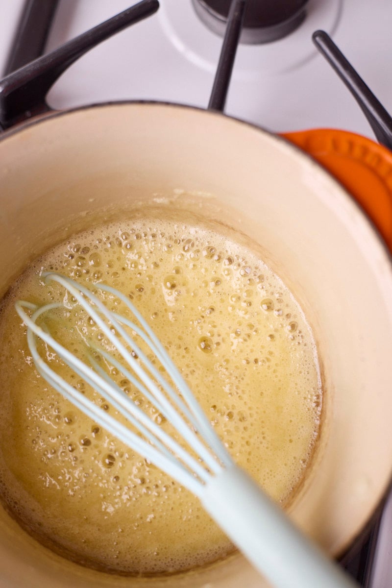 Roux with bubbles in a small saucepan.