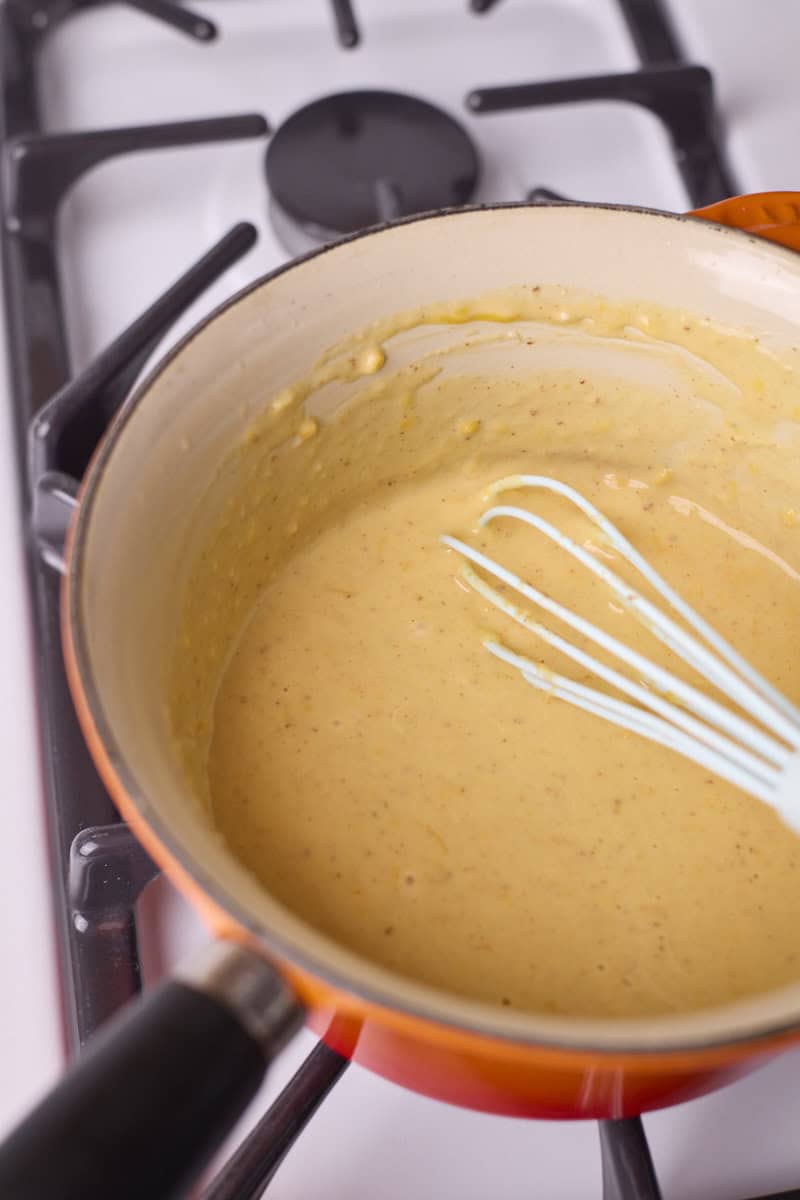 Smooth mixture after whisking in the cheese.