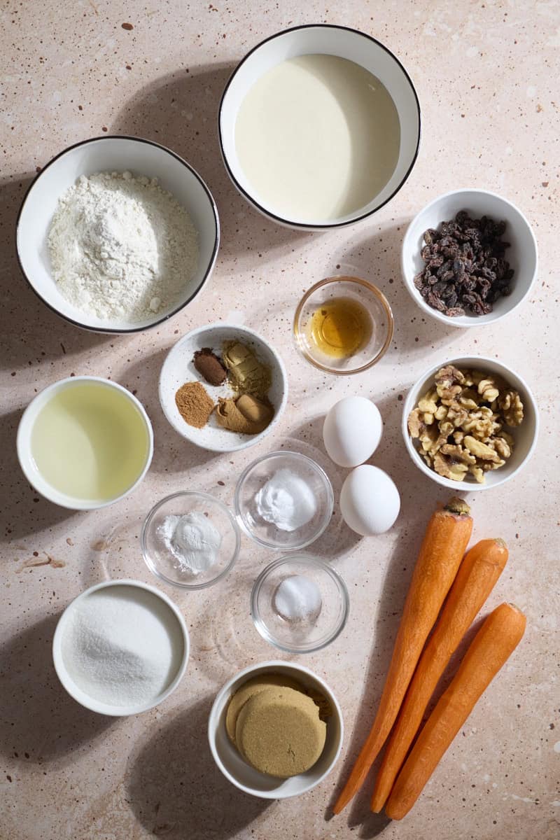 Ingredients for Sourdough Discard Carrot Cake in small bowls.