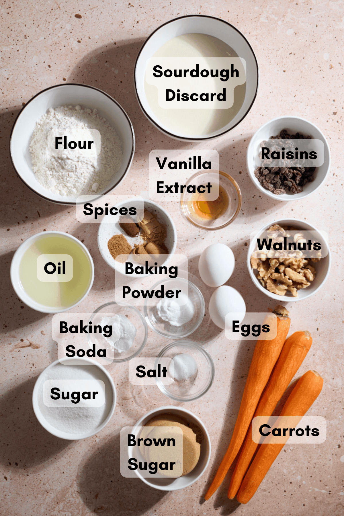 Ingredients for Sourdough Discard Carrot Cake in small bowls. 
