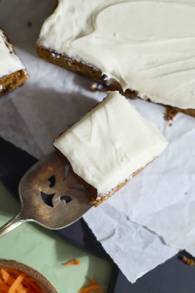 An overhead view of a slice of Sourdough Discard Carrot Cake.