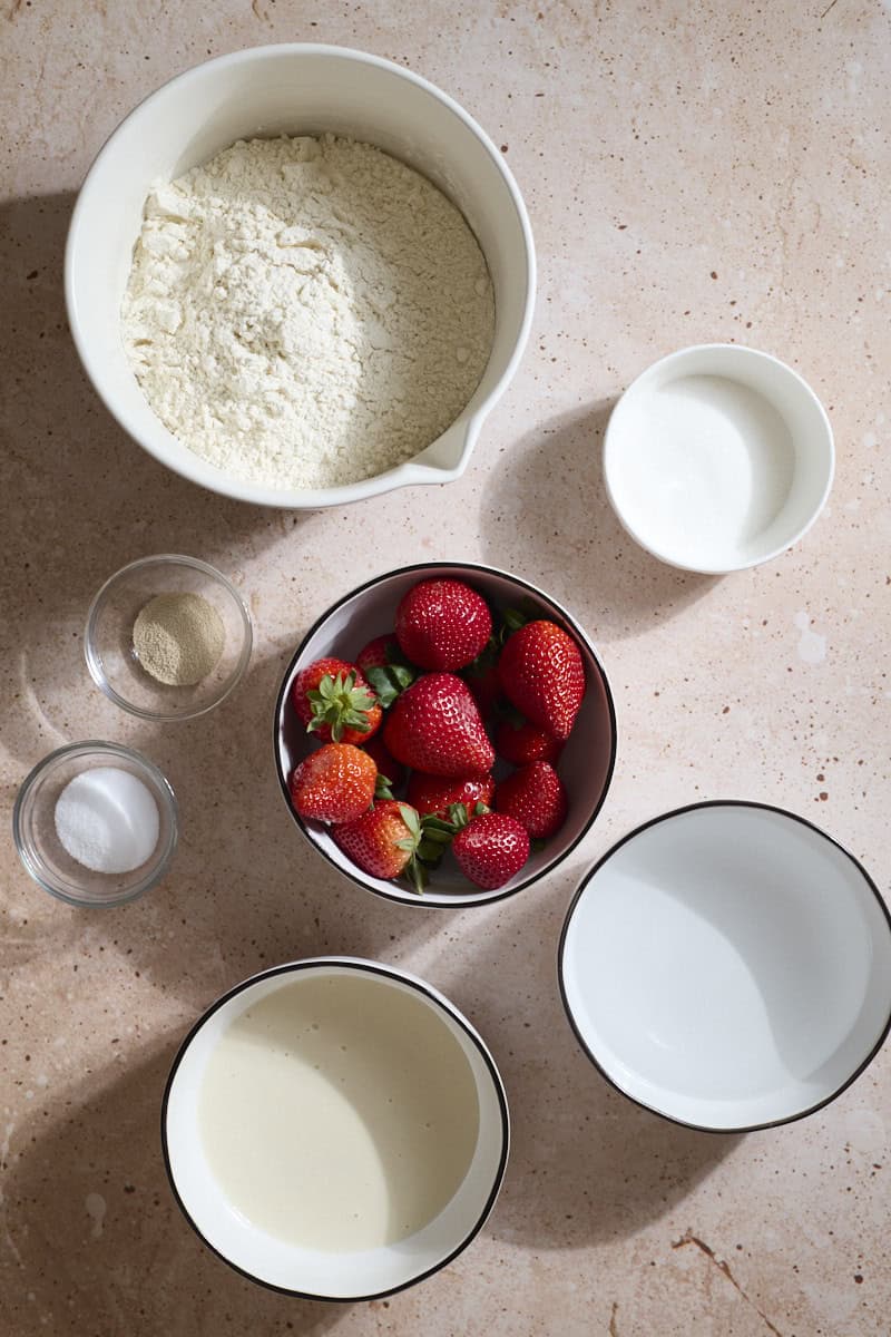 Ingredients for Sourdough Discard Strawberry Bagels in small bowls.