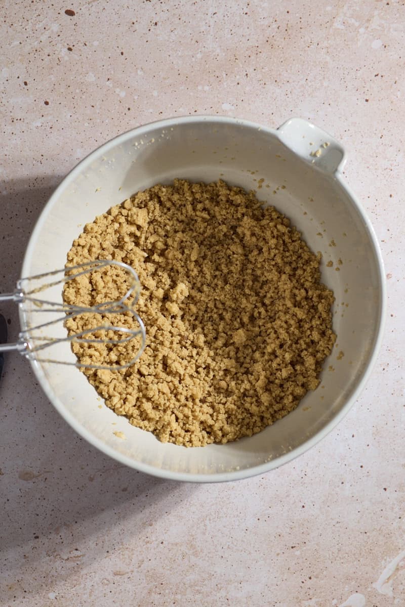 Creamed butter and sugars in a white bowl.
