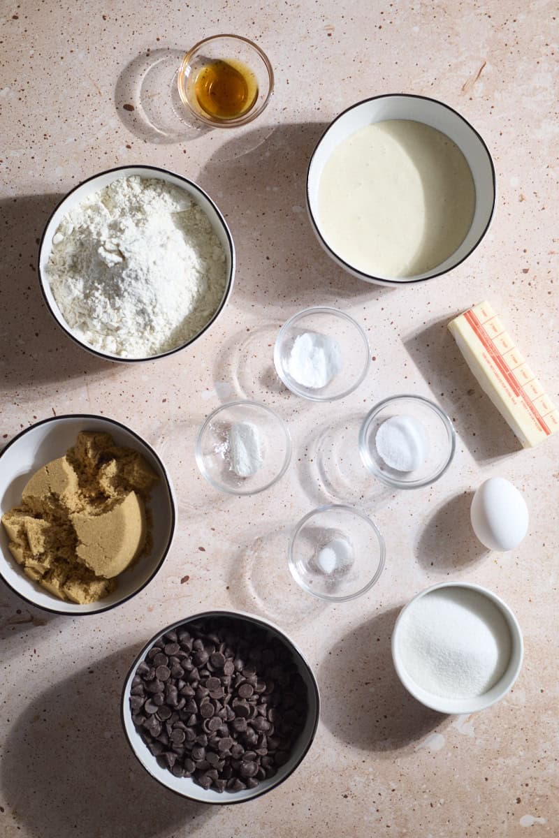 Ingredients for Sourdough Discard Chocolate Chip Cookies in small bowls.