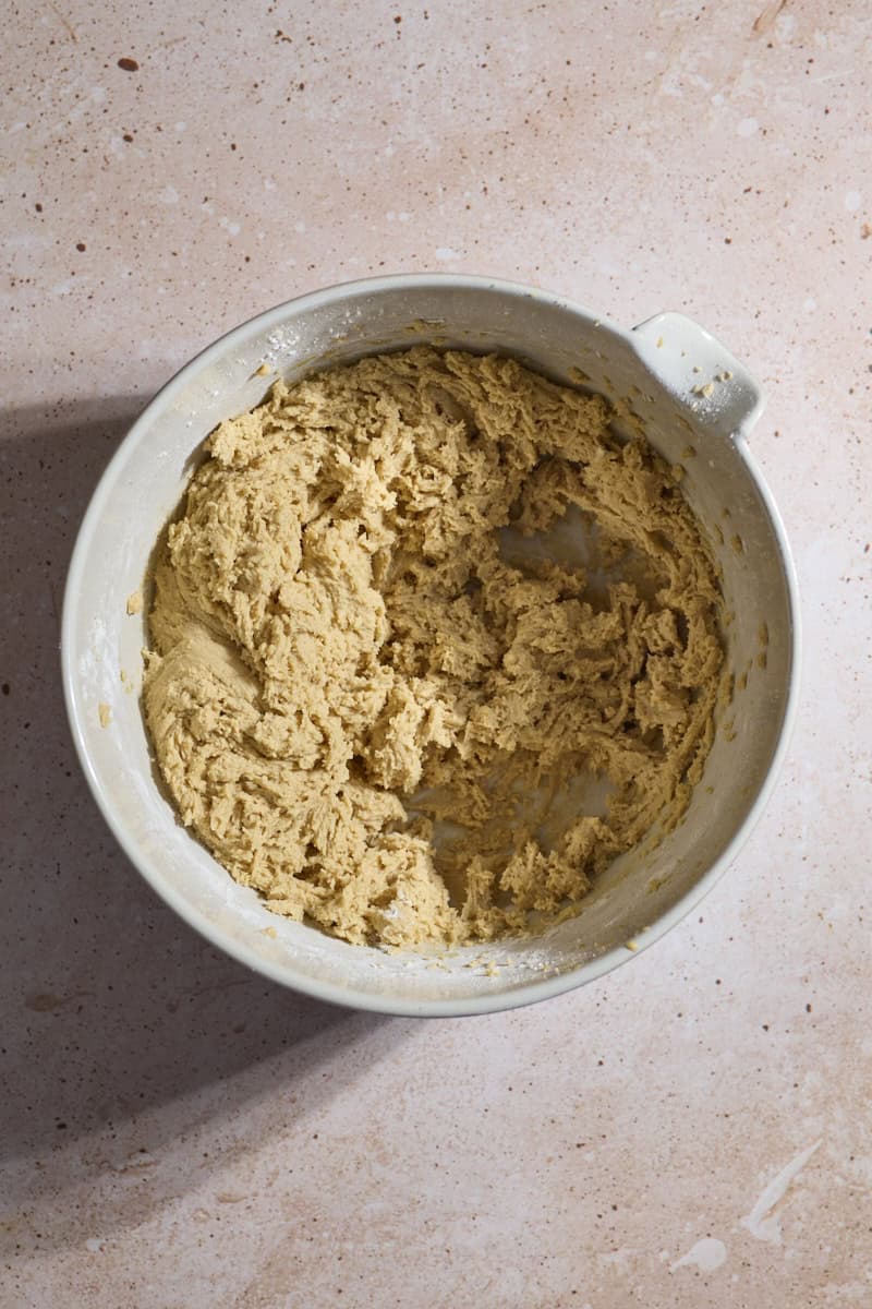 Wet and dry ingredients mixed together in a white bowl.