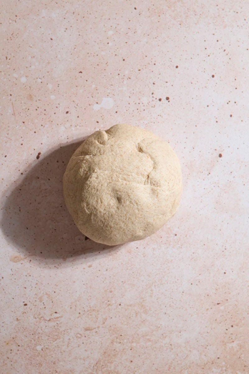 Smooth dough in a ball after kneading.