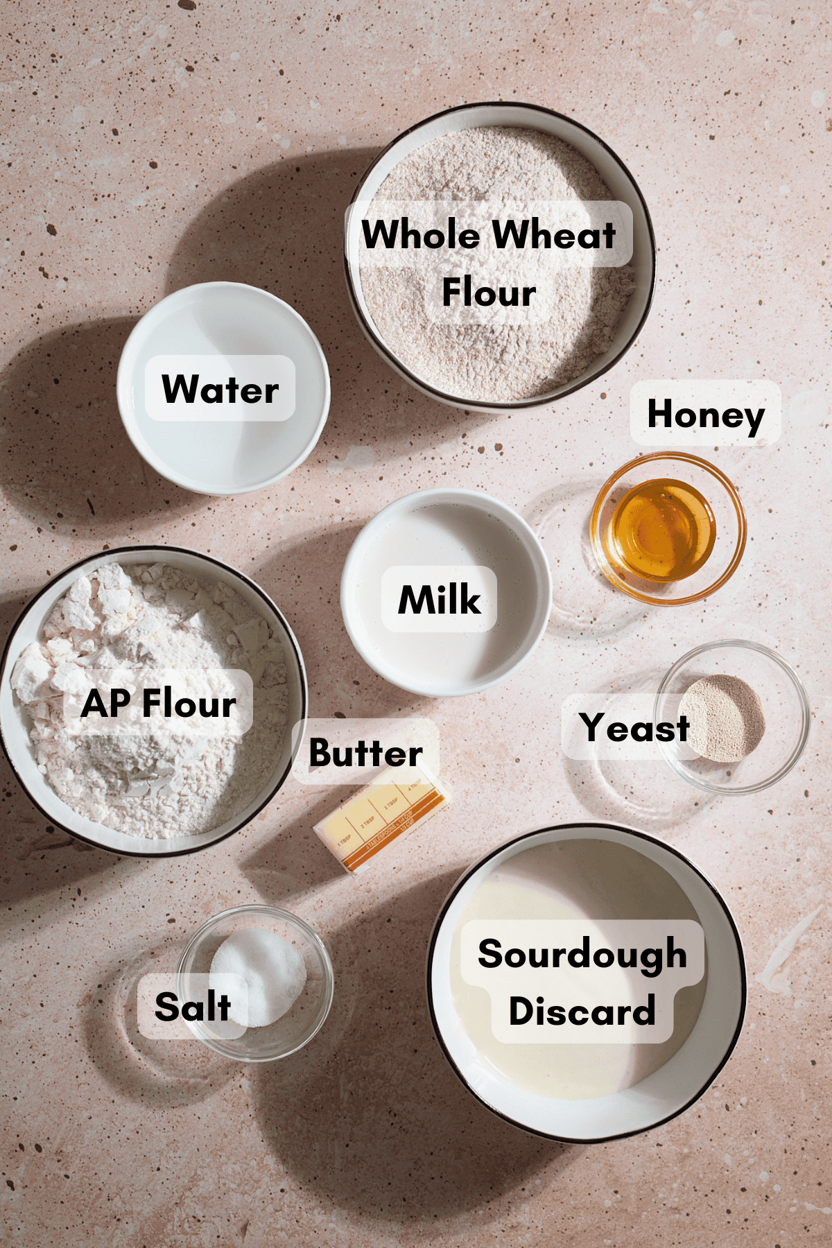 Ingredients for Sourdough Discard Whole Wheat Sandwich Bread in small bowls. 
