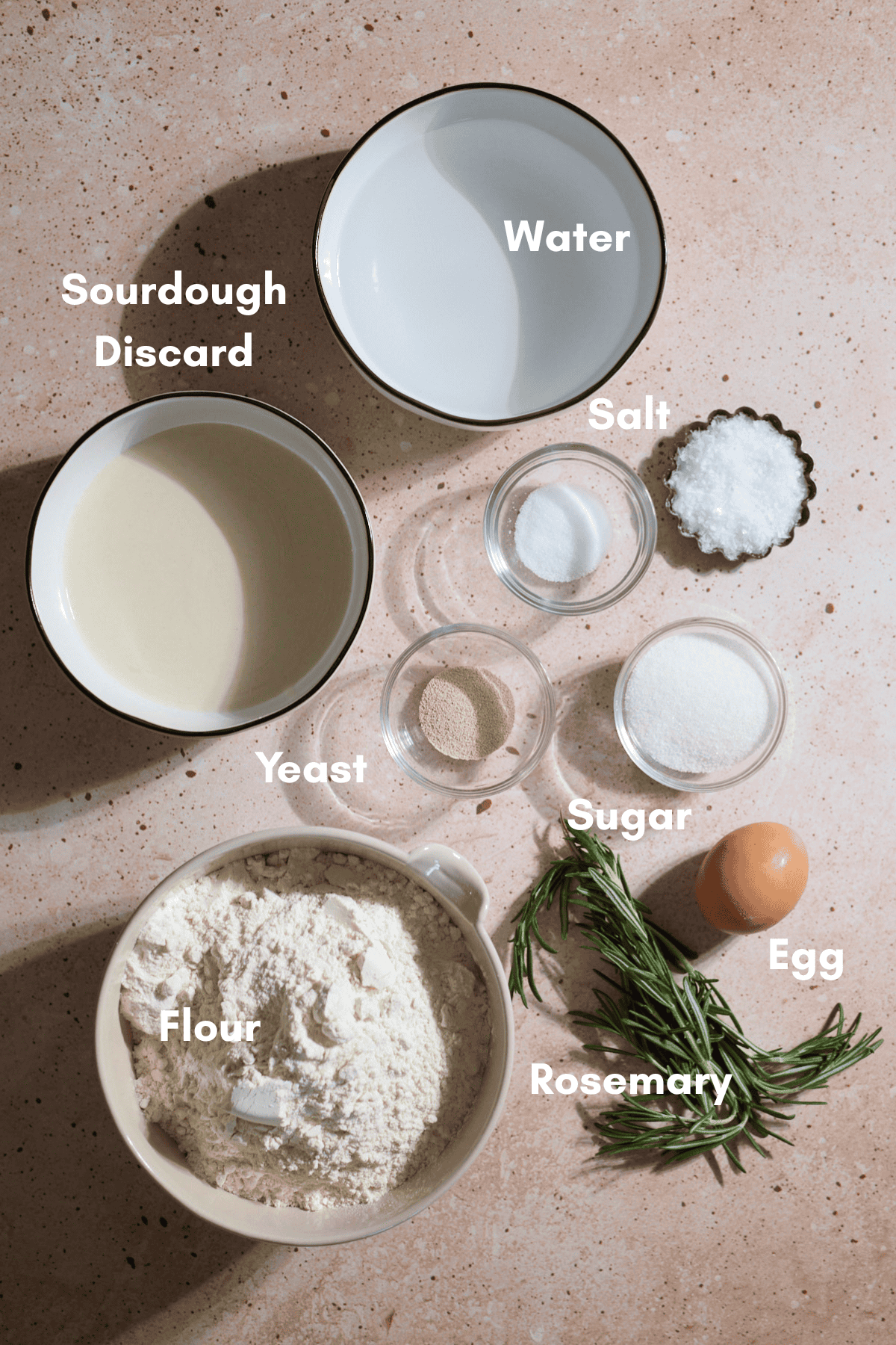 Ingredients for Sourdough Discard Rosemary Salt Bagels in small bowls.