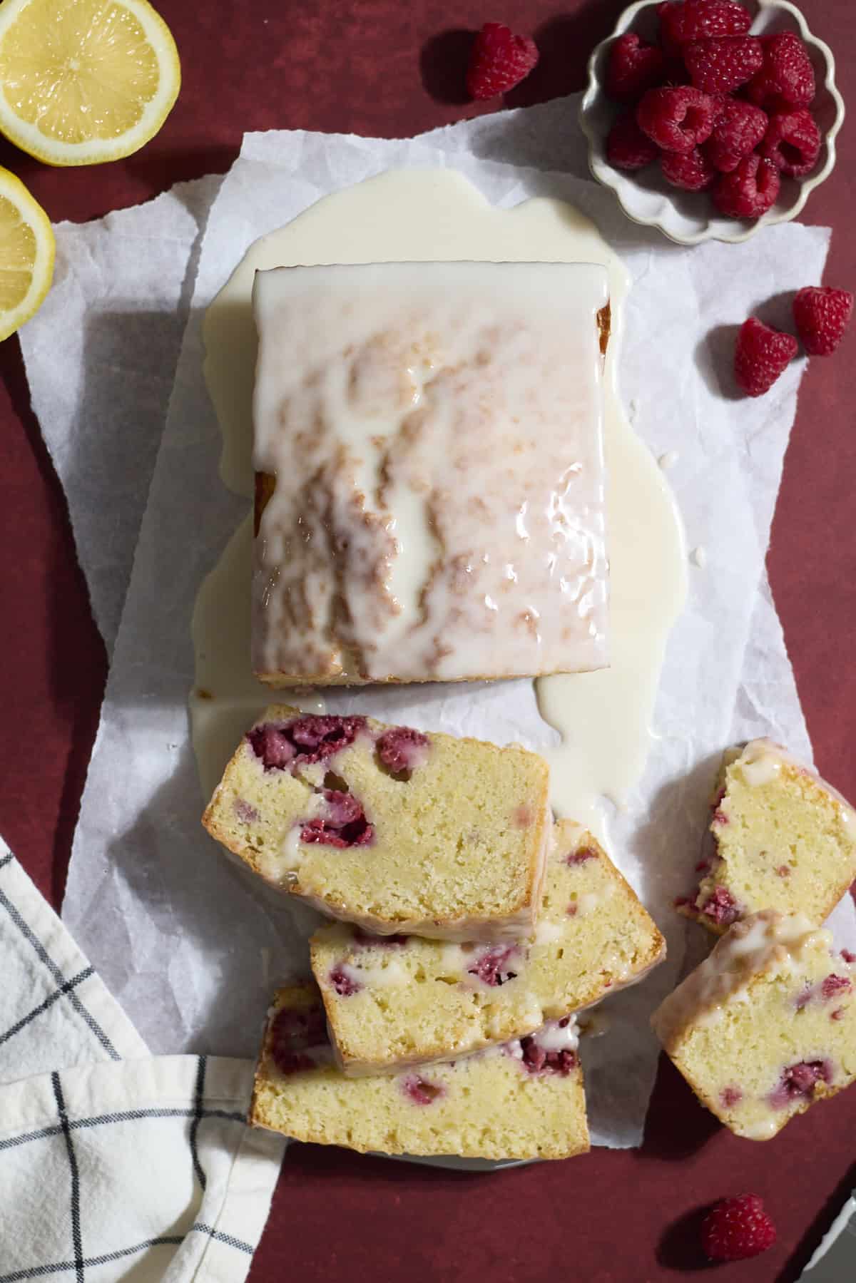 A sliced Sourdough Lemon Raspberry Loaf Cake.