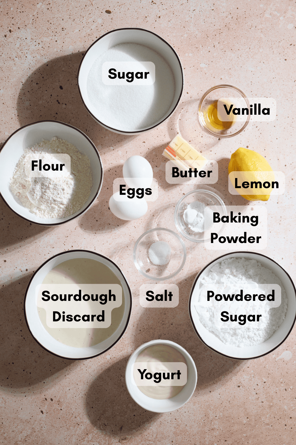 Ingredients for Sourdough Lemon Loaf Cake in small bowls.