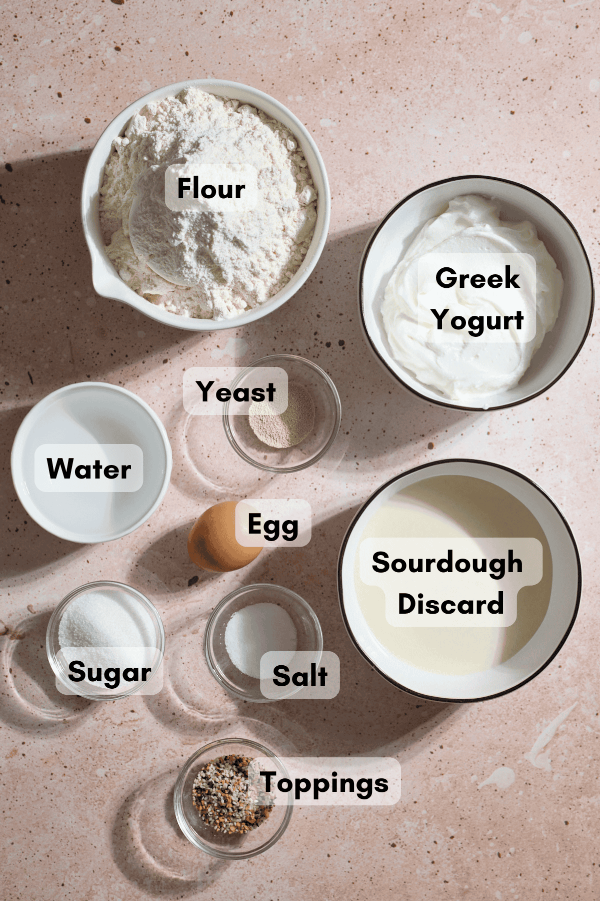Ingredients for Sourdough Discard Protein Bagels in small bowls.