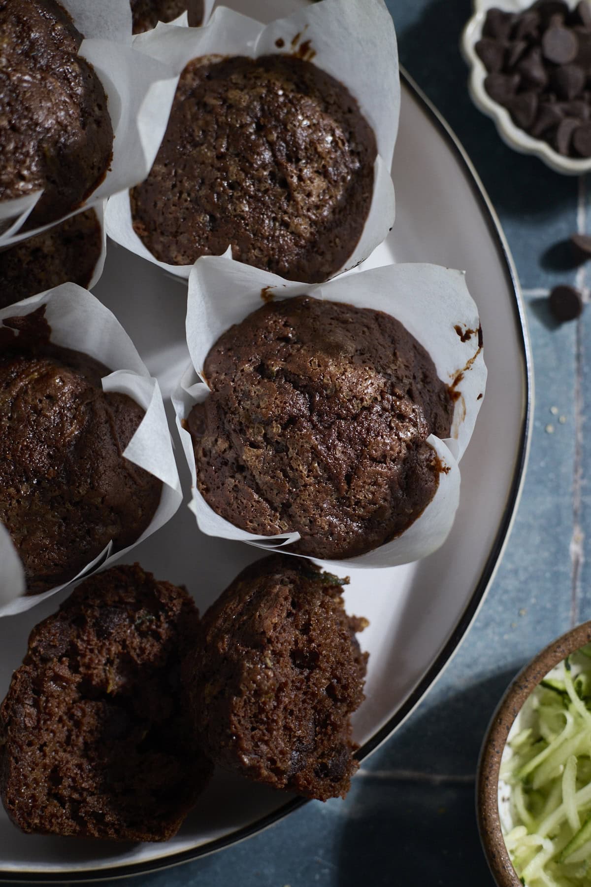 A stack of Chocolate Sourdough Zucchini Muffins.