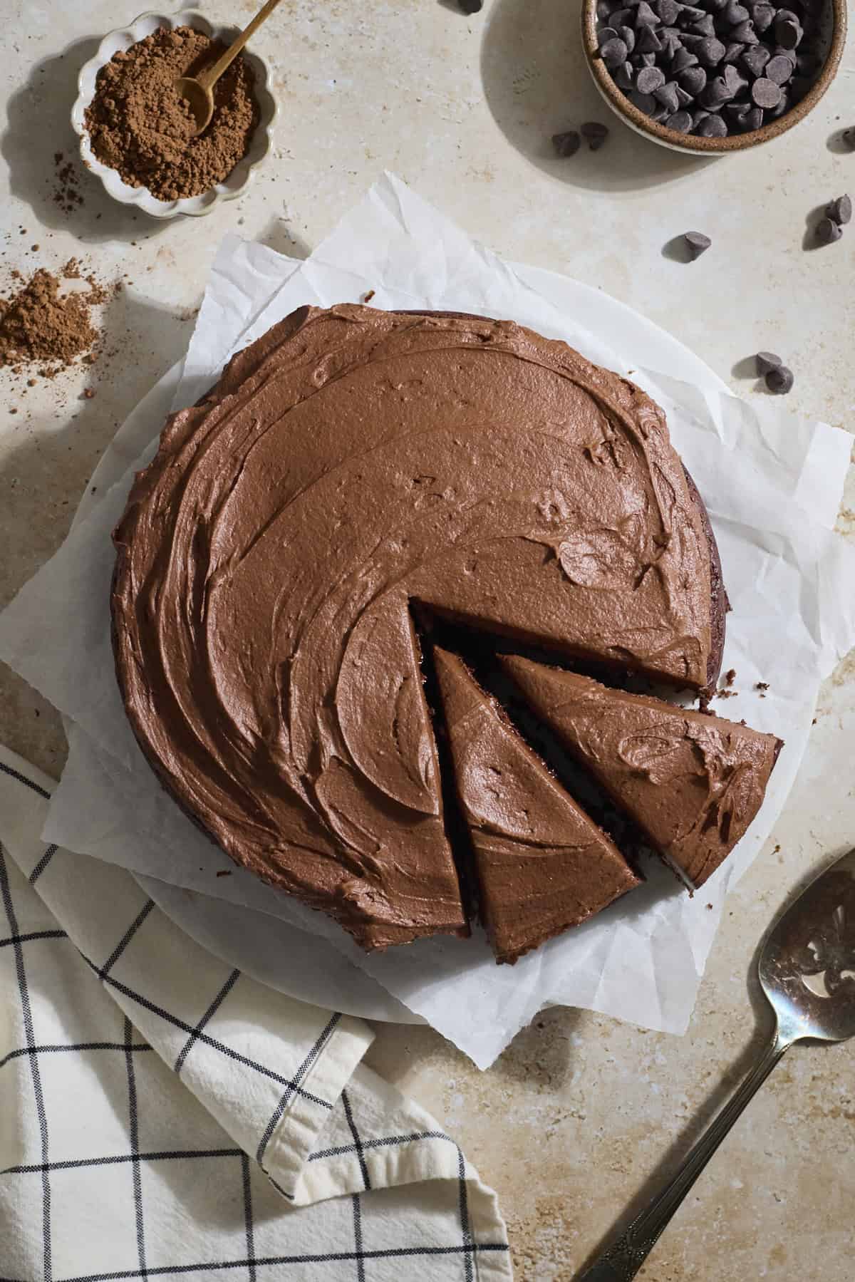 A Sourdough Chocolate Zucchini Cake with two slices cut.