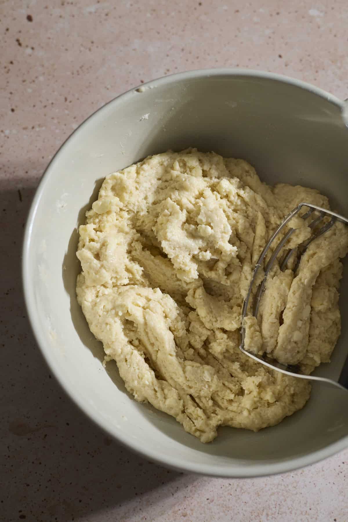 Dough mixed in a large bowl.