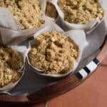 Sourdough Apple Muffins on a wooden tray.