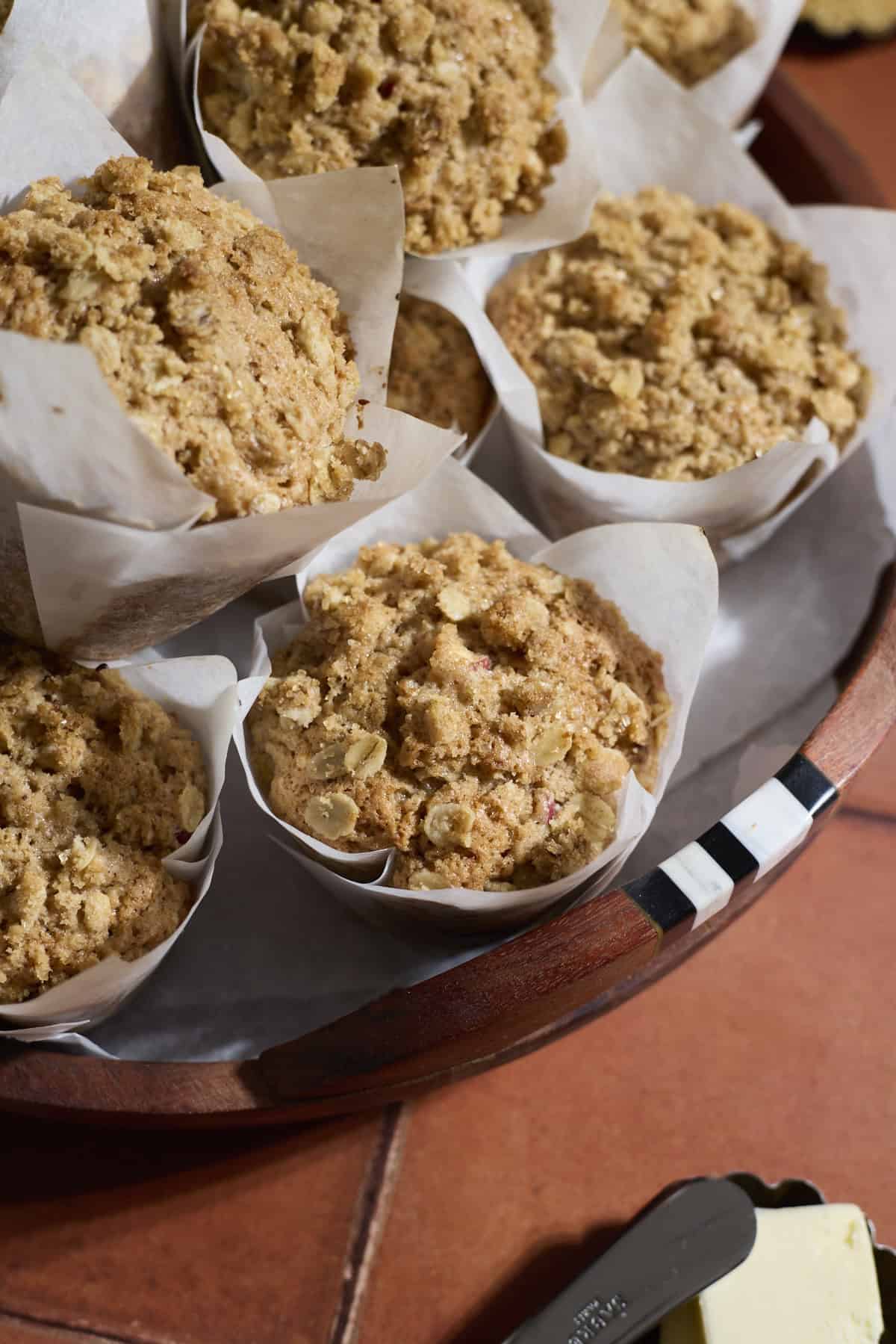 Sourdough Apple Muffins on a wooden tray.