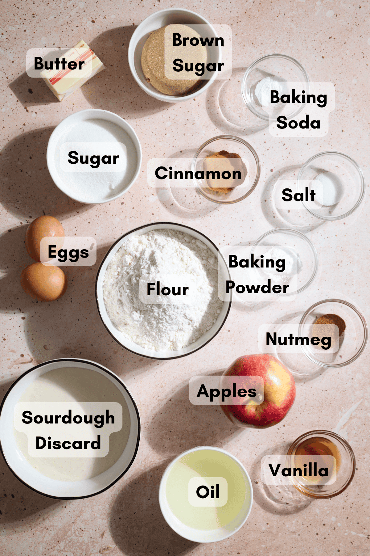 Ingredients for Sourdough Apple Muffins in small bowls.