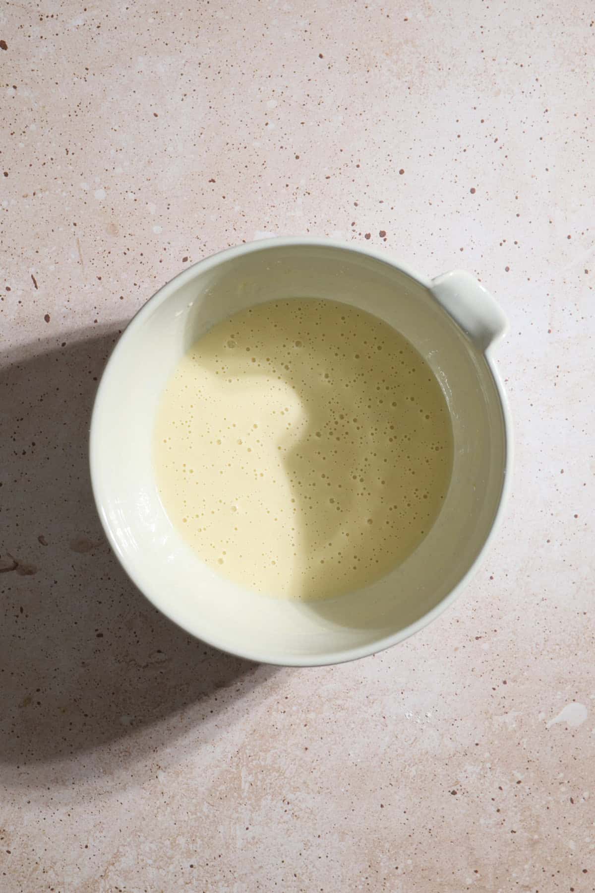Wet ingredients in a large mixing bowl.
