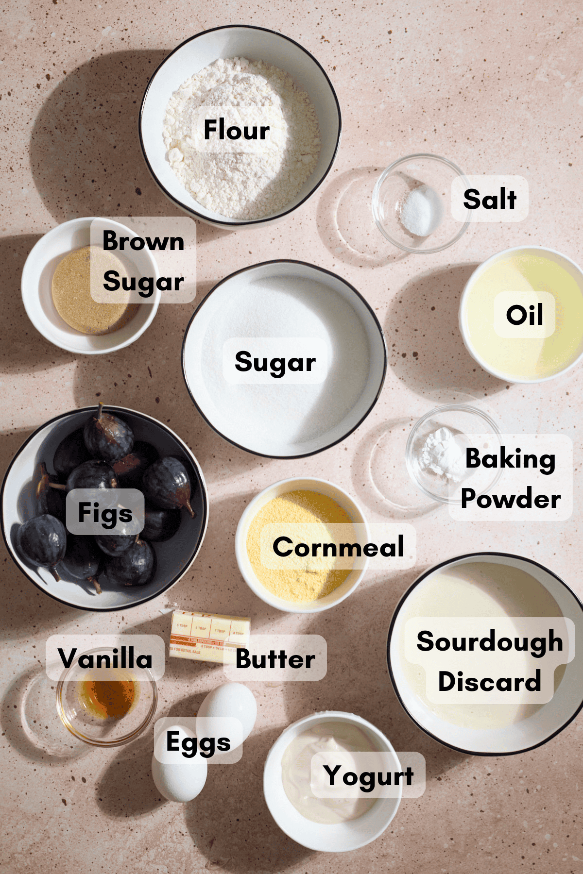 Ingredients for Sourdough Fig Cake in small bowls.