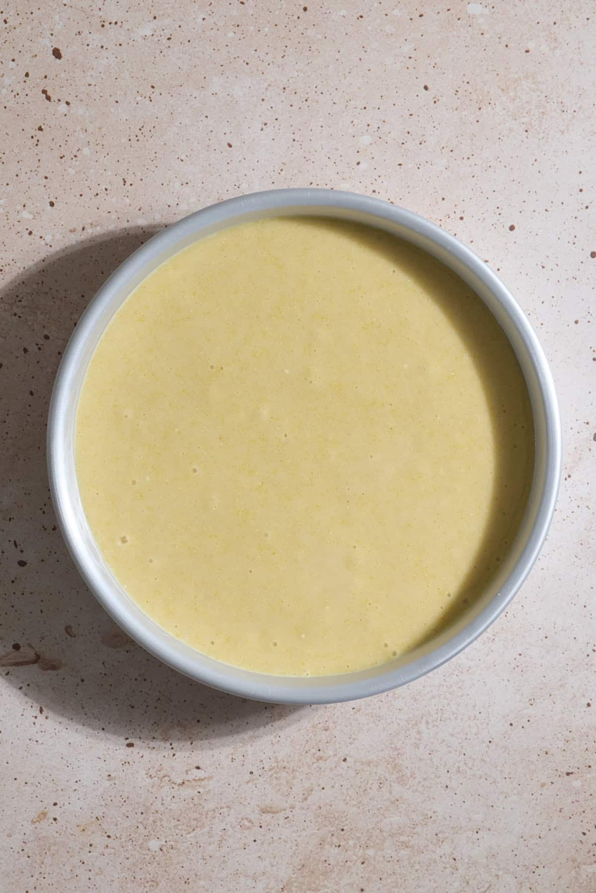 Batter poured into the cake pan.
