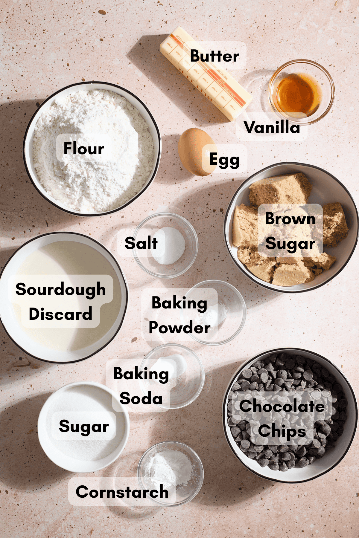 Ingredients for Sourdough Chocolate Chip Cookie Bars in small bowls.