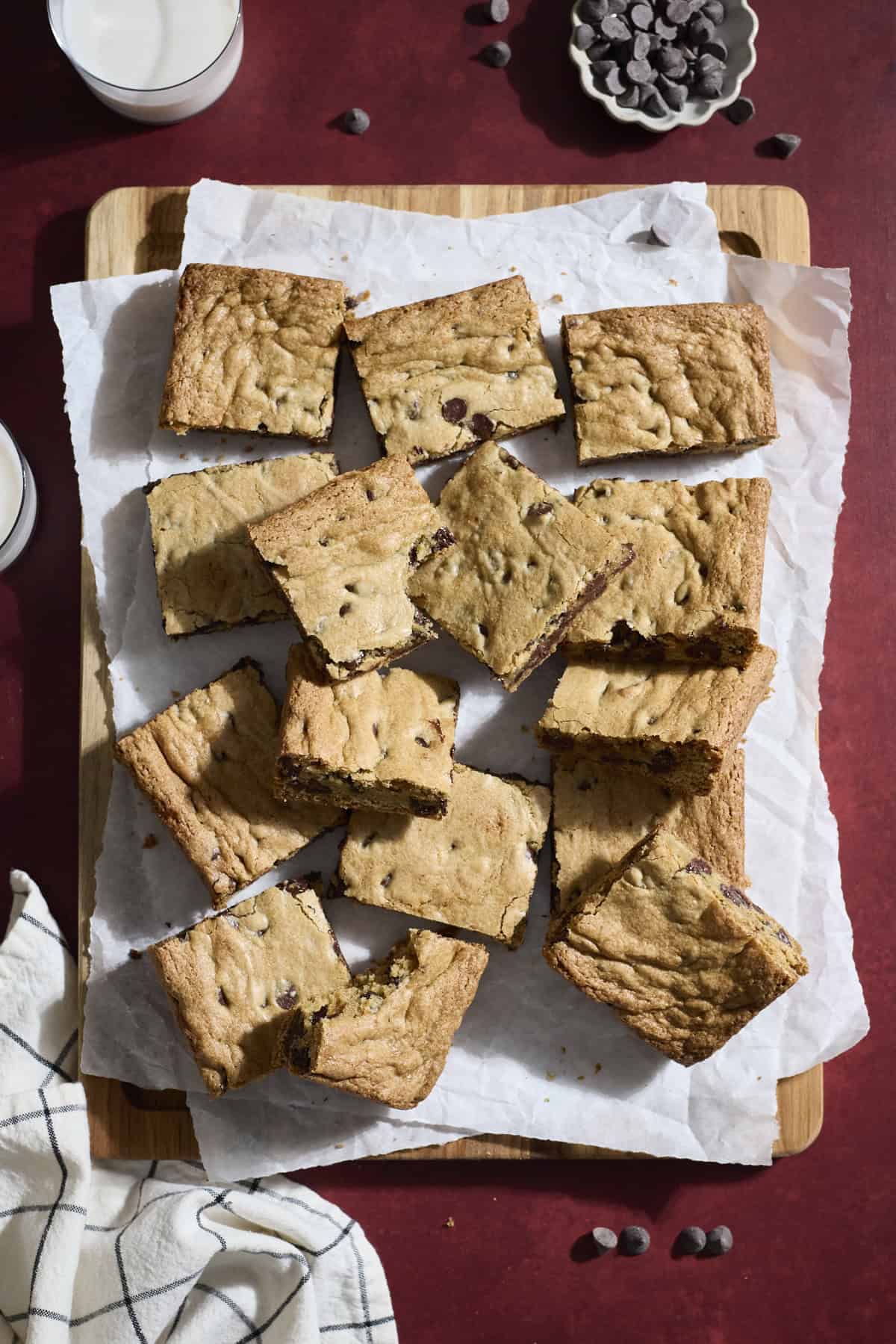 Sliced cookie bars on a wooden cutting board.