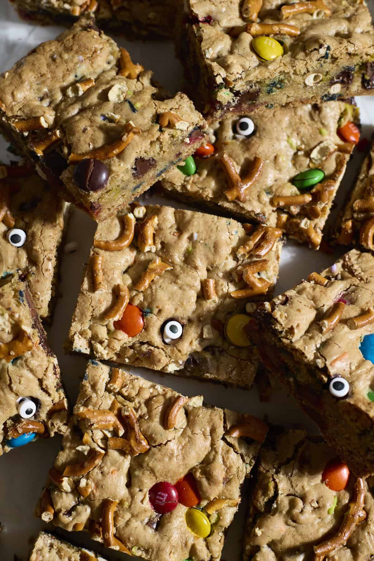 Sliced Sourdough Discard Halloween Kitchen Sink Cookie Bars in a pile.