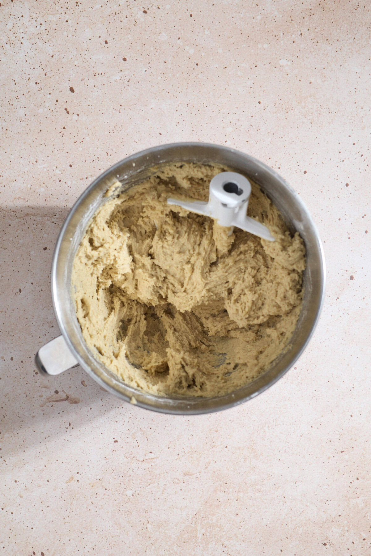 Cookie batter in a large mixing bowl.