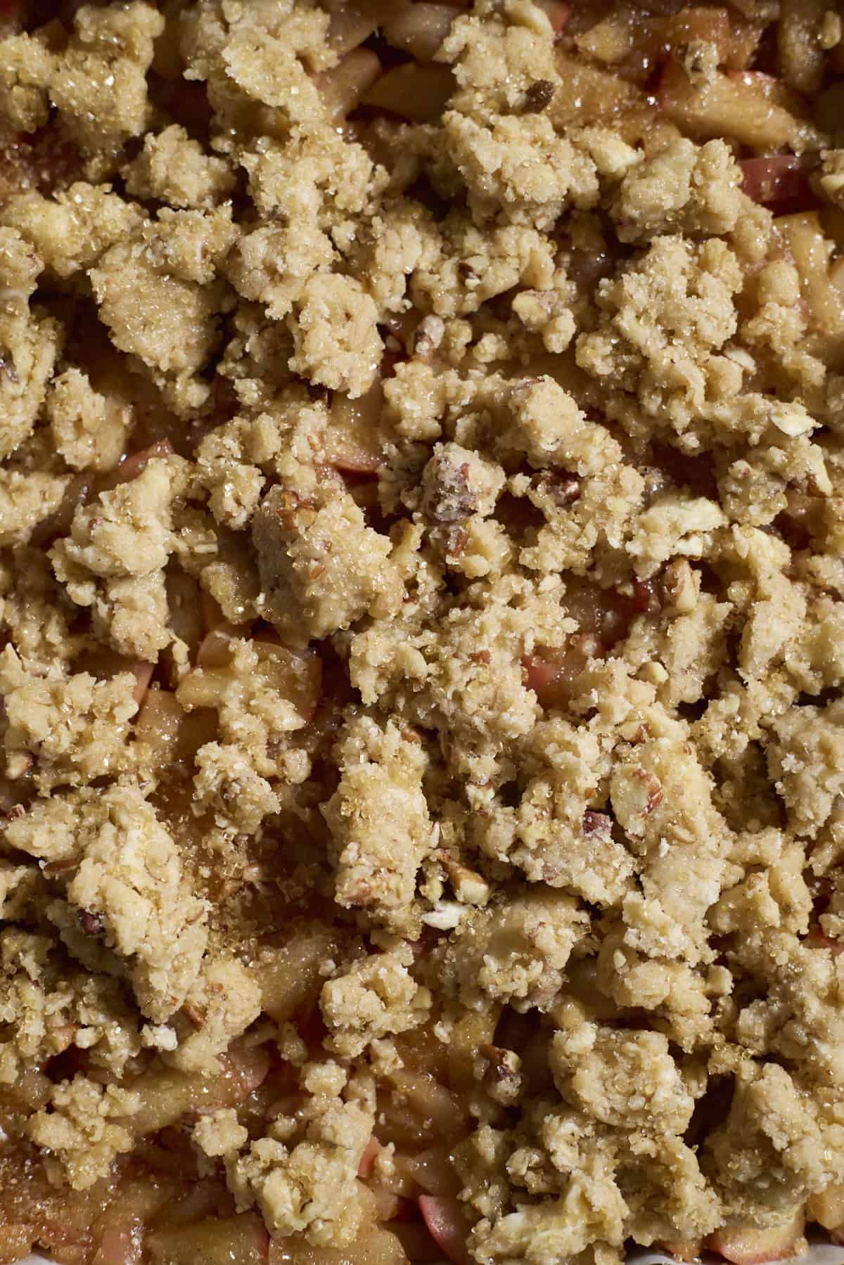 Crumble on top of the apple pie bars.