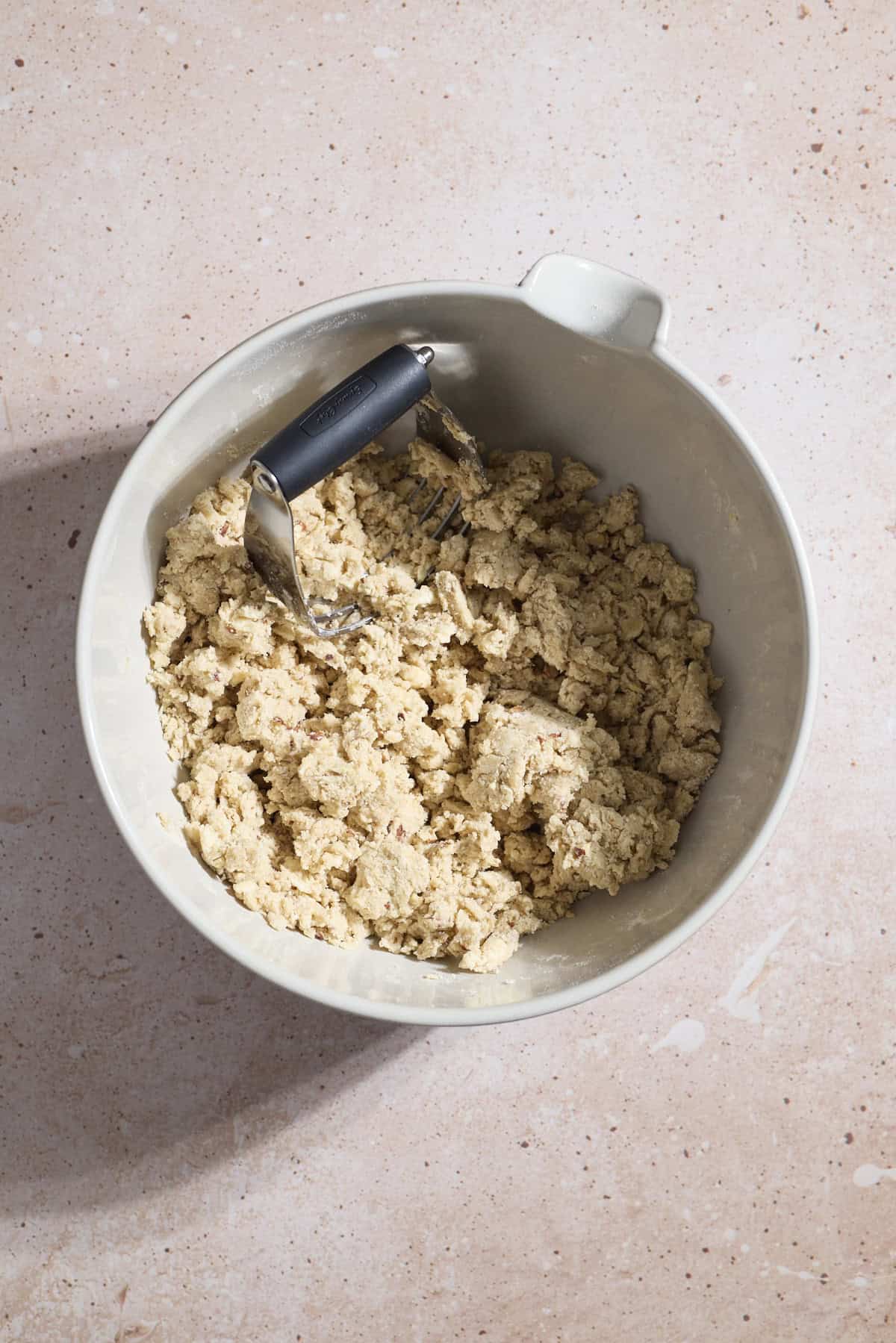 Dough ingredients mixed in a large mixing bowl.