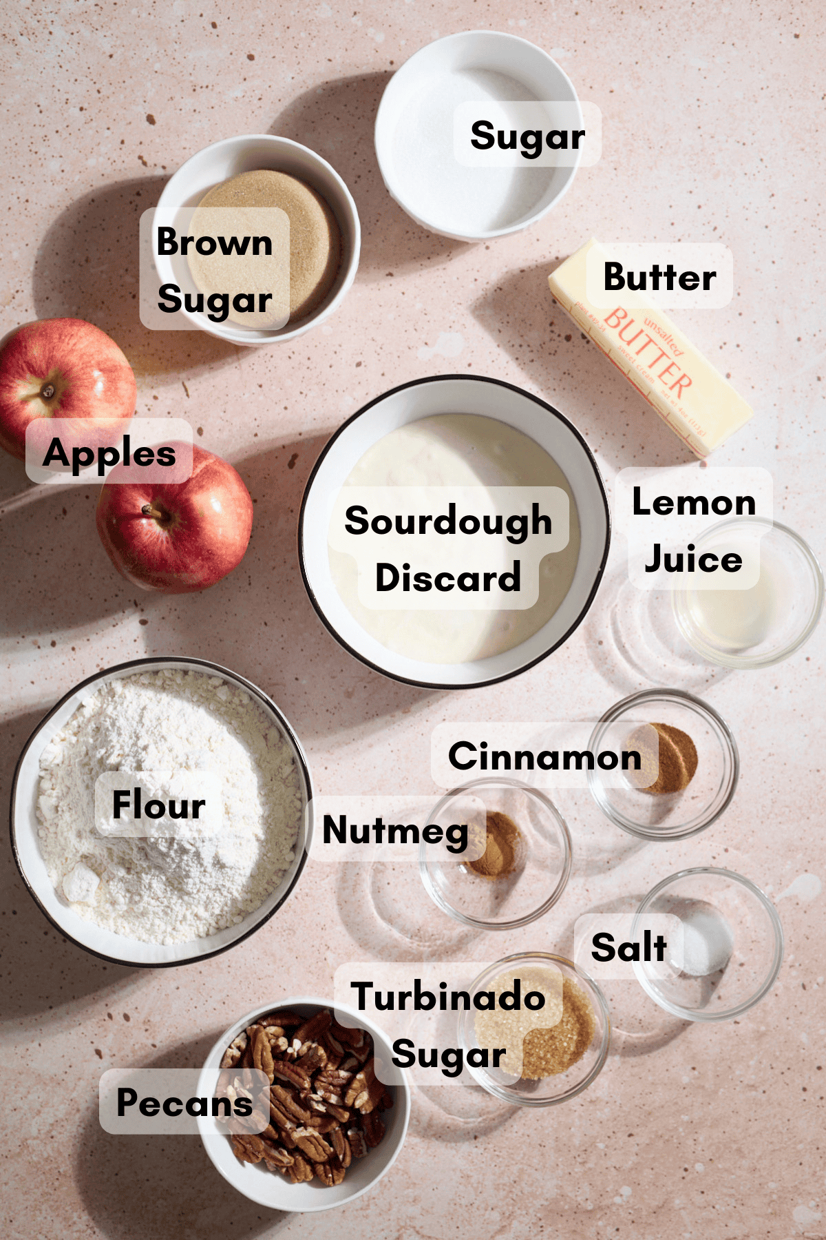 Ingredients for Sourdough Apple Pie Bars in small bowls.