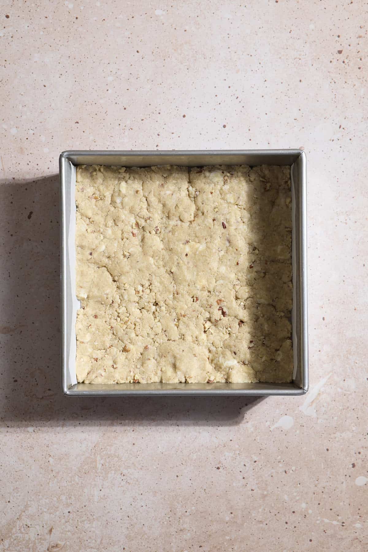 Crust pressed into the baking pan.